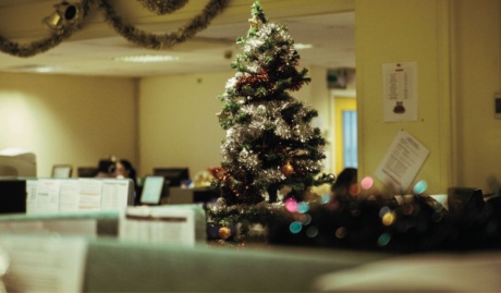 an empty office space during the christmas shutdown period with a christmas tree visible used on a blog about how to protect your business during the festive season